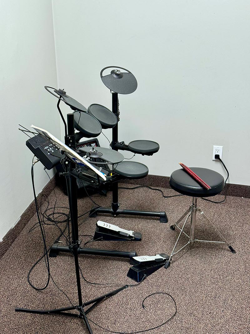 Professional drum lesson space with complete drum kit at Muzart